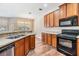Bright kitchen featuring wood cabinets and stainless steel appliances at 3900 Claybrook Dr, Wesley Chapel, FL 33544