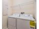 A well-organized laundry room featuring modern washer and dryer units at 3900 Claybrook Dr, Wesley Chapel, FL 33544