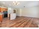 Spacious living room with open floor plan and wood-look flooring throughout at 3900 Claybrook Dr, Wesley Chapel, FL 33544