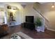 Living room with hardwood floors and stairs to the second floor at 4317 Deermont Cir, Tampa, FL 33624