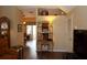 Living room with hardwood floors, leading to the dining area at 4317 Deermont Cir, Tampa, FL 33624