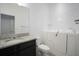 Well lit bathroom with dark wood cabinets, granite counters, and walk-in bathtub at 4927 Rolling Green Dr, Wesley Chapel, FL 33543