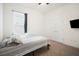 Bright bedroom with a ceiling fan, large window and closet at 4927 Rolling Green Dr, Wesley Chapel, FL 33543