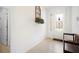 Inviting foyer featuring decorative tile flooring, a decorative floral piece, and a stylish front door at 4927 Rolling Green Dr, Wesley Chapel, FL 33543