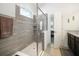 Gorgeous walk-in shower with glass door and tiled surround at 4927 Rolling Green Dr, Wesley Chapel, FL 33543