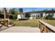 Backyard view of a waterfront home with a wooden footbridge at 5253 Dover Ne St, St Petersburg, FL 33703