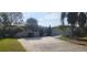 House exterior with a large yard and palm trees at 5253 Dover Ne St, St Petersburg, FL 33703