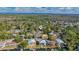 Aerial view of a house near the water, surrounded by other homes and trees at 6119 Beacon Point Dr, Weeki Wachee, FL 34607
