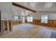 Under renovation living room with exposed beams and new flooring at 6119 Beacon Point Dr, Weeki Wachee, FL 34607