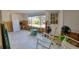 Under renovation sunroom with tiled floor and large window at 6119 Beacon Point Dr, Weeki Wachee, FL 34607