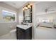 Stylish bathroom featuring a vanity with a marble countertop and modern fixtures at 633 Poinsettia Rd, Belleair, FL 33756