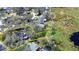 Aerial view of a home on a large lot shaded by mature trees with a pond nearby at 801 Timber Pond Dr, Brandon, FL 33510