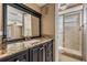 Bathroom featuring a black vanity with granite countertop and glass-enclosed shower at 8922 Catalina Dr, Port Richey, FL 34668