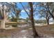 Waterfront backyard with mature trees at 9205 Tudor Dr # C107, Tampa, FL 33615