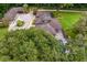 Aerial view of the estate featuring a large home, detached garages and swimming pool at 1007 Lakewood Dr, Brandon, FL 33510