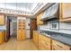 Kitchen showcasing wood cabinets, stainless steel range hood, and floral patterned ceiling at 1007 Lakewood Dr, Brandon, FL 33510