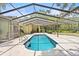 A screened-in pool with tile flooring at 1007 Lakewood Dr, Brandon, FL 33510