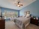 Bright bedroom with a comfortable bed and plenty of closet space at 10120 Post Harvest Dr, Riverview, FL 33578