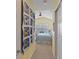 Hallway with access to bedroom and features a handmade quilt at 10120 Post Harvest Dr, Riverview, FL 33578