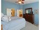 Comfortable bedroom with ensuite bathroom and ample storage at 10120 Post Harvest Dr, Riverview, FL 33578