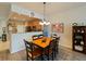 Bright dining area with wood table and six chairs, near kitchen at 10120 Post Harvest Dr, Riverview, FL 33578