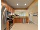 Modern kitchen with stainless steel appliances and granite countertops at 10120 Post Harvest Dr, Riverview, FL 33578