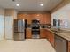 Modern kitchen with stainless steel appliances and granite countertops at 10120 Post Harvest Dr, Riverview, FL 33578