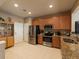 Modern kitchen with stainless steel appliances and granite countertops at 10120 Post Harvest Dr, Riverview, FL 33578