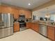 Modern kitchen with stainless steel appliances and granite countertops at 10120 Post Harvest Dr, Riverview, FL 33578