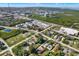 Aerial view of a commercial and residential area with mature trees and a highway at 10455 14Th Ne St, St Petersburg, FL 33702