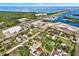 Wide aerial shot of a coastal home near a marina with waterfront views and a vibrant, developed neighborhood at 10455 14Th Ne St, St Petersburg, FL 33702