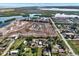 An aerial view shows new home construction next to a river and existing neighborhood at 10455 14Th Ne St, St Petersburg, FL 33702