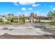 Exterior view of a home with a covered front porch and carport at 10455 14Th Ne St, St Petersburg, FL 33702