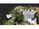 Aerial view of the home showcasing the backyard patio, private boat dock, and waterfront location at 10532 94Th Pl, Seminole, FL 33772