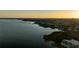 Aerial view of a lake and a city coastline at sunset at 10532 94Th Pl, Seminole, FL 33772