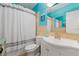 Light bathroom featuring a shower with light turquoise paint and modern fixtures at 10532 94Th Pl, Seminole, FL 33772