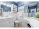 Clean bathroom with white vanity, tile floors and blue walls at 10532 94Th Pl, Seminole, FL 33772