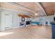 Large main bedroom featuring wood-beam ceiling, fireplace, light wood floors and a light-colored wall at 10532 94Th Pl, Seminole, FL 33772