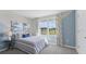 Bedroom with a window offering a view and a neutral color scheme at 10596 Farm Hill Ave, Land O Lakes, FL 34638