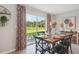 Dining area with sliding glass doors leading to backyard at 10596 Farm Hill Ave, Land O Lakes, FL 34638