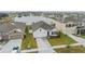 Aerial view of a house and neighborhood with a lake at 11976 Brighton Knoll Loop, Riverview, FL 33579