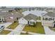 Aerial view of a house and neighborhood with a lake at 11976 Brighton Knoll Loop, Riverview, FL 33579