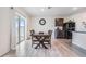 Bright dining area with sliding glass doors and a wooden dining table at 11976 Brighton Knoll Loop, Riverview, FL 33579