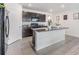 Modern kitchen that features dark brown cabinets, stainless steel appliances, and granite countertops at 11976 Brighton Knoll Loop, Riverview, FL 33579