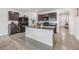 Kitchen with dark brown cabinets, granite island, and stainless steel appliances at 11976 Brighton Knoll Loop, Riverview, FL 33579