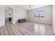 Spacious living room with light gray wood flooring at 11976 Brighton Knoll Loop, Riverview, FL 33579