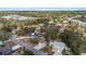 An aerial view of homes, pools, and tennis courts in a suburban neighborhood at 1217 Carmella Ln, Sarasota, FL 34243