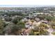 Aerial view of residential neighborhood with mature trees and well-maintained homes at 1217 Carmella Ln, Sarasota, FL 34243