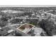 A black and white aerial view of a home with a pool at 1217 Carmella Ln Sarasota, FL 34243 at 1217 Carmella Ln, Sarasota, FL 34243