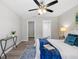 Calming bedroom with an updated ceiling fan, neutral walls, and new floors at 1217 Carmella Ln, Sarasota, FL 34243